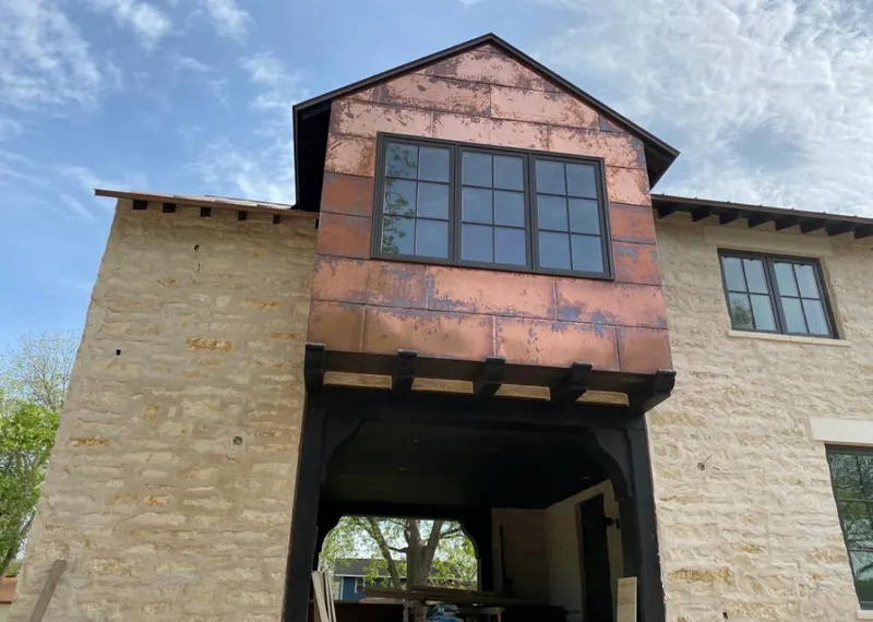 Copper metal panel facade on a stone building for Metal Roof Coating in Chandler